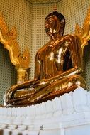 statue of golden buddha in thailand temple