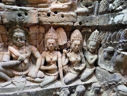 women as a carving in a temple in cambodia