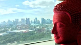 red head sculpture of Buddha in Bangkok