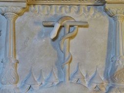ancient Stone relief, snake on rod