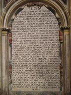 aged Latin writing on wall of cathedral, Spain, Burgos