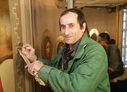 painter at work in the temple