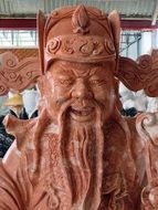 carved statue of a deity in a temple in vietnam