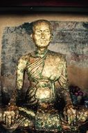 aged Buddha figure