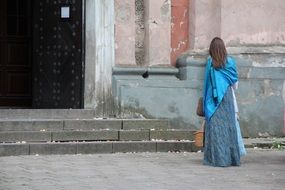 woman near the entrance to the church