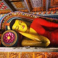 Beautiful colorful Reclining Buddha in Sri Lanka