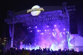 panoramic view of a rock concert on a bright stage