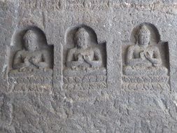 carved on the stone buddha statues in ajanta
