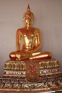 Golden Buddha for meditation in a temple in Bangkok