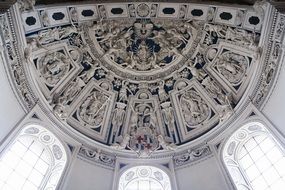 stone panel of figurines on the ceiling in the Church