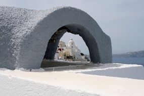 distant view of the white church on santorini island