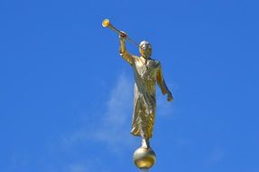 golden statue of a angel at a temple in Moroni