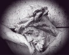 wooden carved head of jesus closeup
