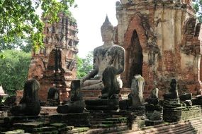 statue among the ruins of an ancient temple in Ayutthaya