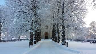 snowy alley to the church gate