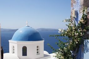 church with blue dome on santorini island