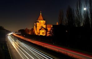 night photo of highway with spotlights