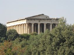 Temple behind the green trees in Athena