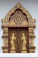 relief carved on wooden shutters of the temple