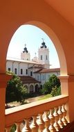 view through the arched doorway to the church
