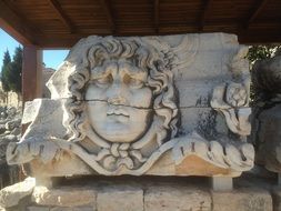 carving on the wall the temple of apollo in turkey