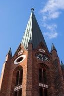 spire on a brick church building