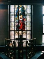 stained glass window depicting a saint on the cathedral