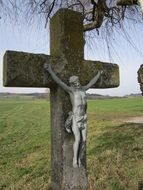 ancient stone Wayside Cross at countryside, germany. bavaria