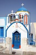 church with blue doors in santorini