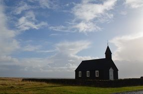 small church in wilderness at evening sky, Iceland, Budir