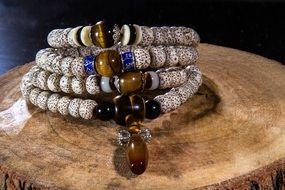 Buddhist rosary with pearls and brown stones