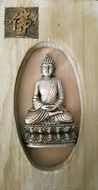 wood carving in the form of a buddha