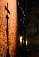 Shadow of crucifixion on wall in Candle Light