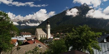panoramic view of the church in the city at the foot of the mountains in arzl im pitztal