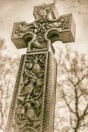 aged ornate stone Cross, gravestone, sepia