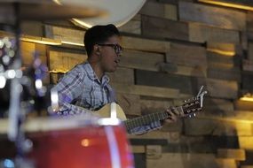 a man plays the guitar