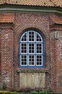 Blue and white church window in the wall