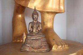 Buddha, Small Statue at feet of big one