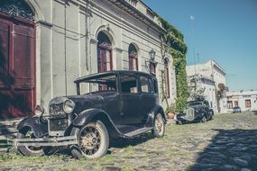 old cars on the paved road