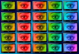 wall of monitors with colorful eyes pictures