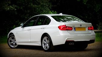 rear view of a luxury white BMW