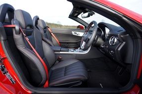 luxurious interior of a red Mercedes Benz