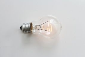 light bulb with glow on white