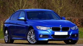 front view of a luxury blue car