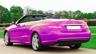 rear view of a luxury pink car