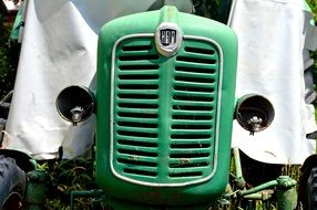 Close-up of the old green tractor