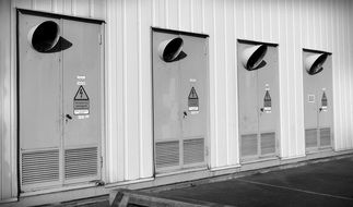 black and white photo of electricity service doors