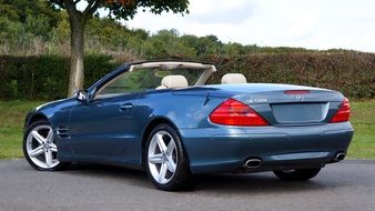 side view of a luxury Mercedes without a roof