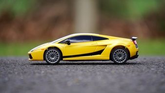 yellow lamborghini as a model on the pavement