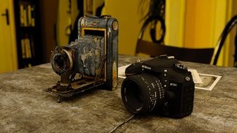 modern and antique cameras on the table